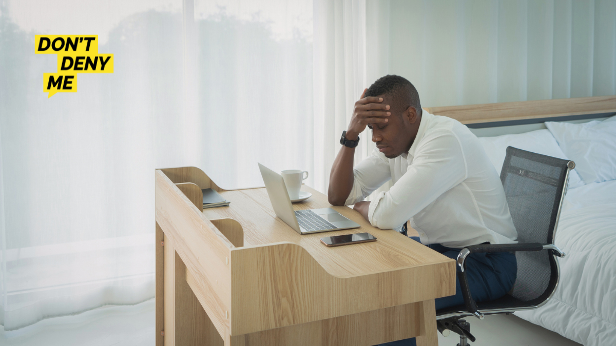 man at table looking overwhelmed