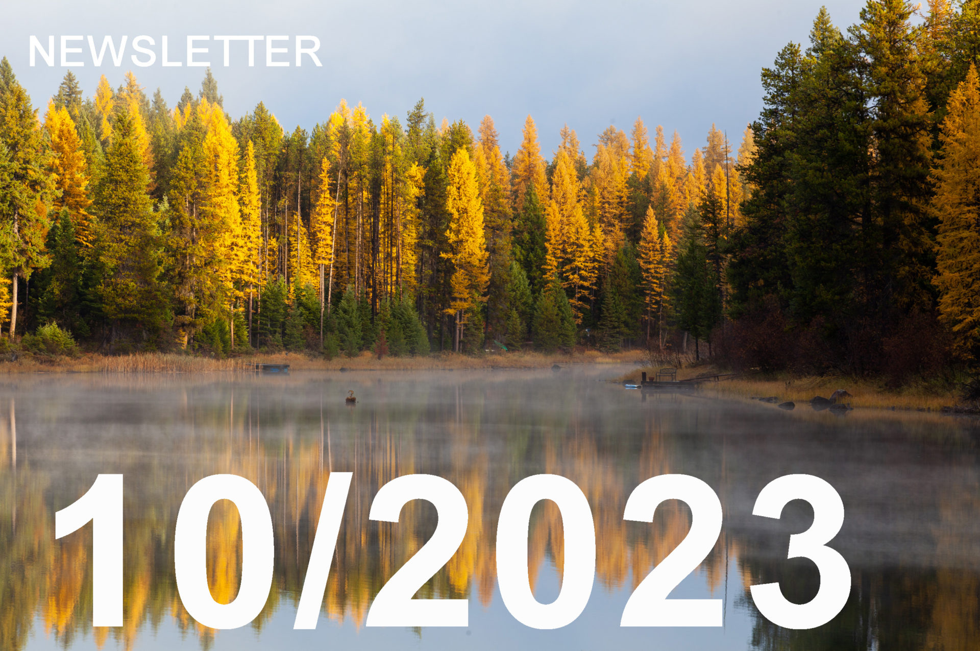 image is of a mountain lake with steam rising from it, as the fall colors are present in the background.