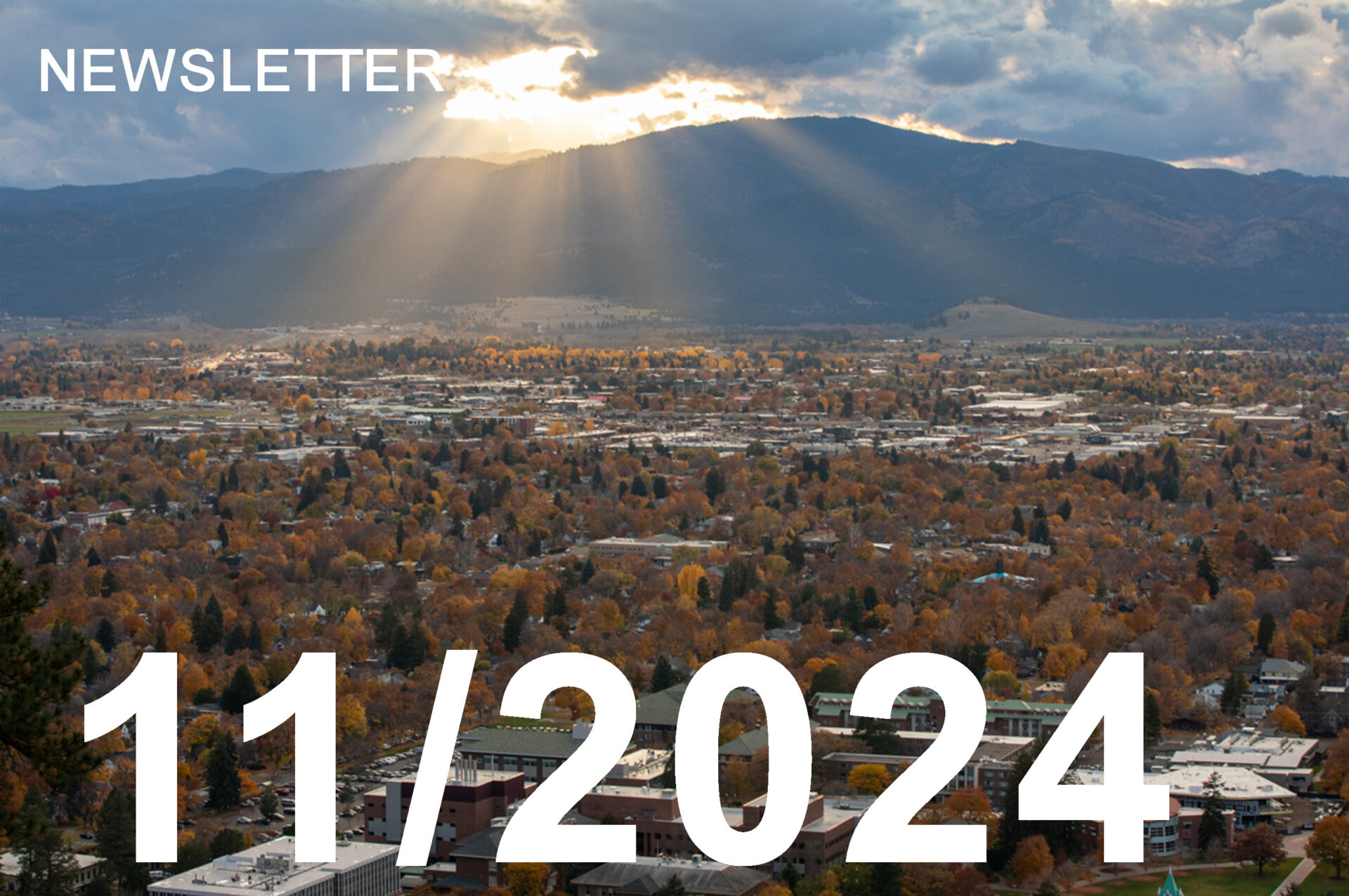 photo os sun rays striking through grey clouds in the late fall in Montana.